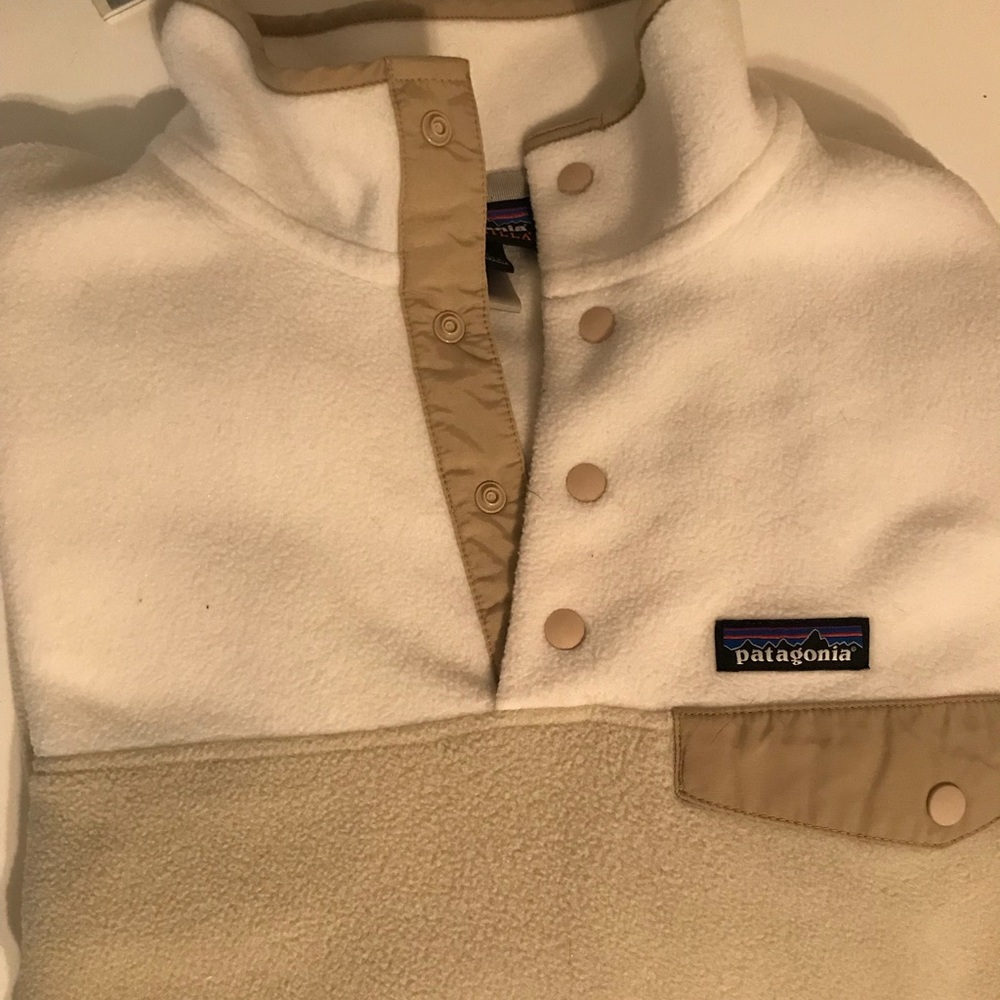 large white and tan Patagonia jacket